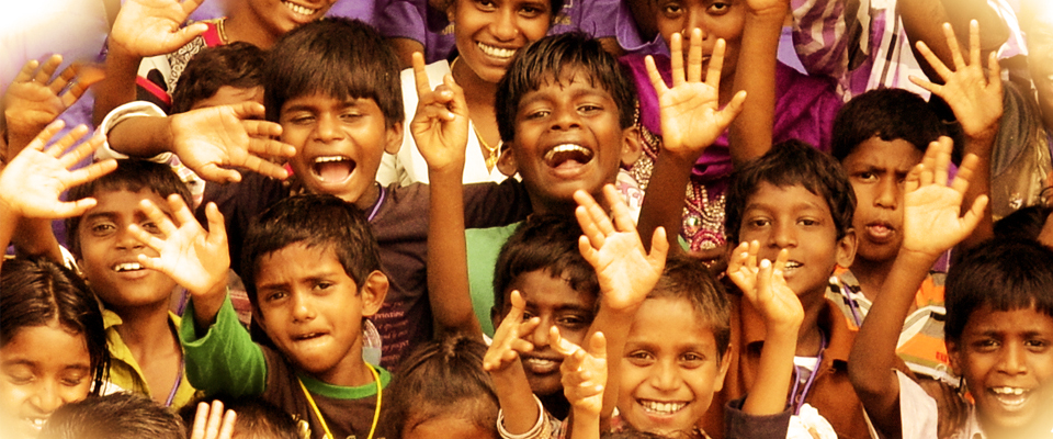 Volunteers helping and smiling with children and elderly people in a community